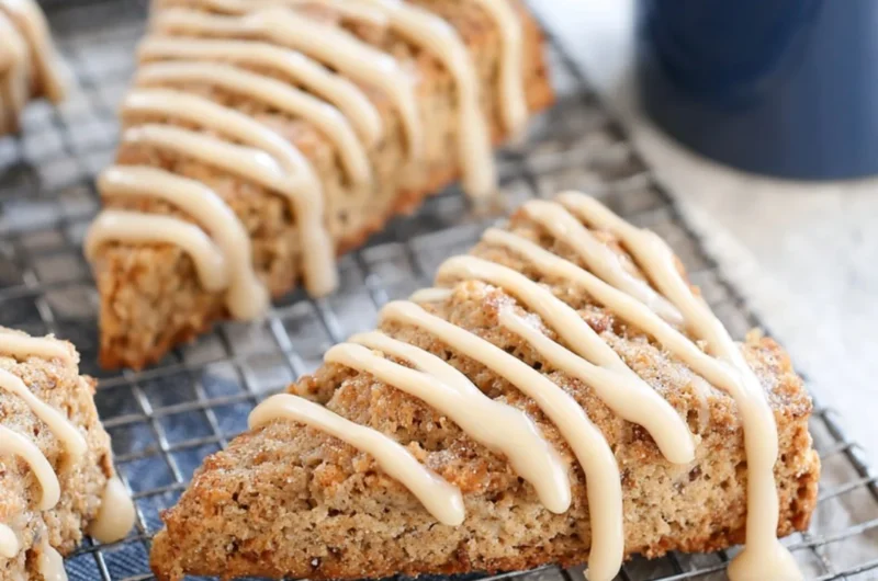 Freshly baked banana bread scones on a cooling rack