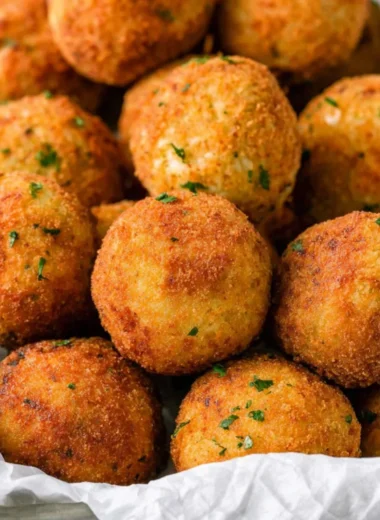 Delicious cheesy rice balls (arancini) ready to enjoy as a snack or appetizer.