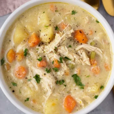 Bowl of delicious Chicken Pot Pie Soup garnished with herbs