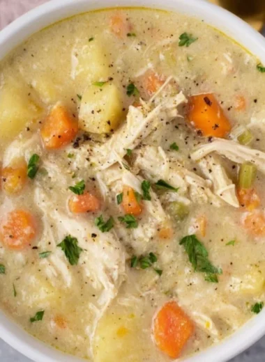 Bowl of delicious Chicken Pot Pie Soup garnished with herbs