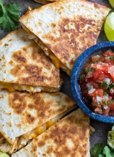 Delicious Chicken Quesadillas filled with cheese and chicken on a plate.