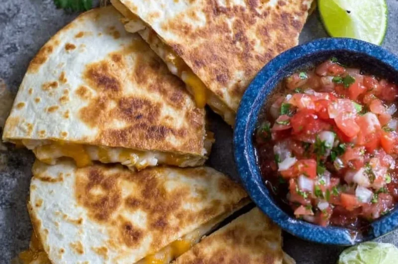 Delicious Chicken Quesadillas filled with cheese and chicken on a plate.