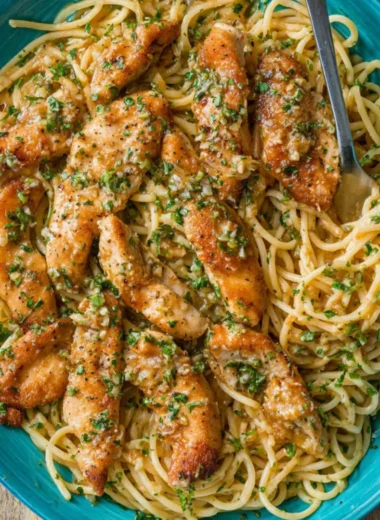 Delicious Chicken Scampi Pasta with garlic, chicken, and herbs served in a bowl.