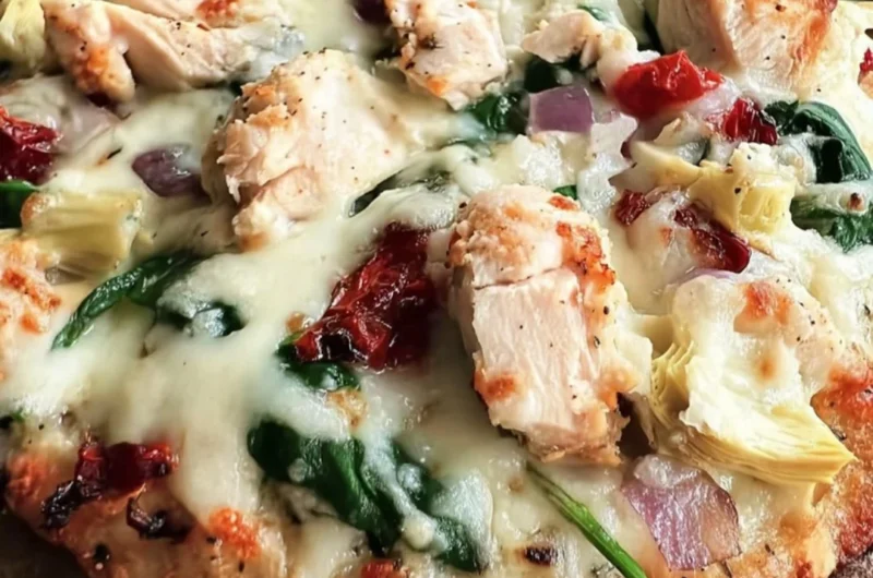 Delicious Chicken Spinach Artichoke Pizza topped with fresh ingredients