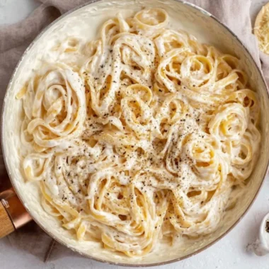Creamy Cottage Cheese Alfredo sauce served over pasta with fresh herbs.