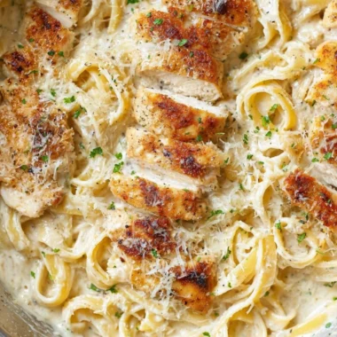 Creamy Chicken Fettuccine Alfredo served in a bowl garnished with parsley