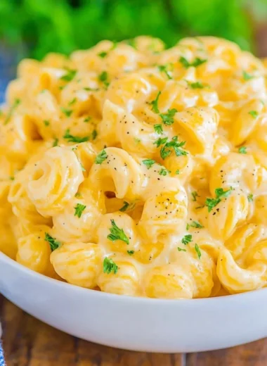 Creamy mac and cheese dish topped with golden breadcrumbs