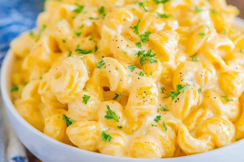 Creamy mac and cheese dish topped with golden breadcrumbs