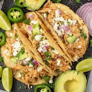 Crockpot Chicken Tacos: tender chicken in soft tortillas topped with fresh ingredients