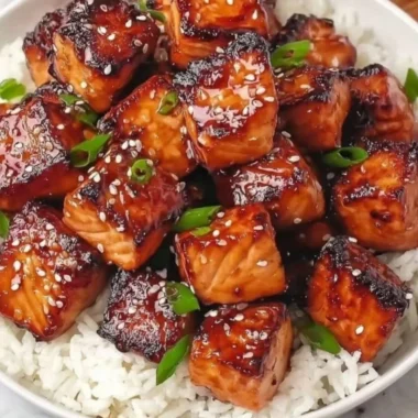 Honey garlic salmon bites bowl with colorful veggies and rice