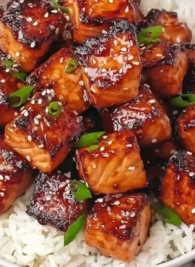 Honey garlic salmon bites bowl with colorful veggies and rice
