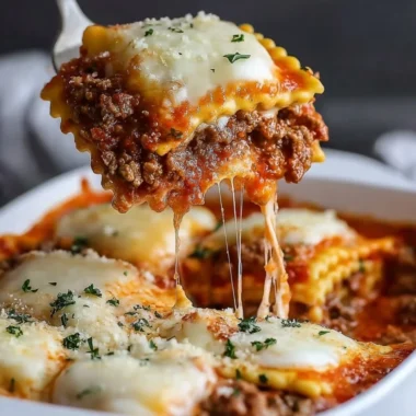 Delicious Million Dollar Ravioli Casserole topped with cheese and herbs.