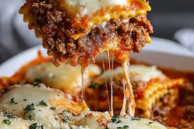 Delicious Million Dollar Ravioli Casserole topped with cheese and herbs.