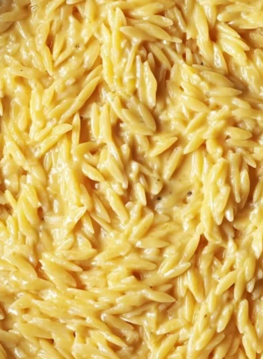 Serving of protein-packed cottage cheese orzo with fresh vegetables