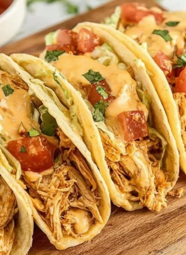 Bowl of Slow Cooker Queso Chicken Tacos topped with fresh cilantro