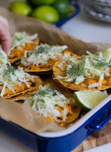 Smashed Buffalo Chicken Tacos topped with Ranch Slaw
