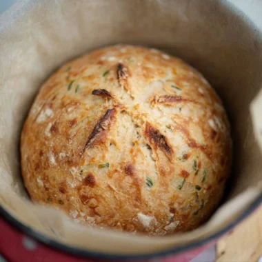 Freshly baked sourdough jalapeño cheddar artisan bread with a golden crust