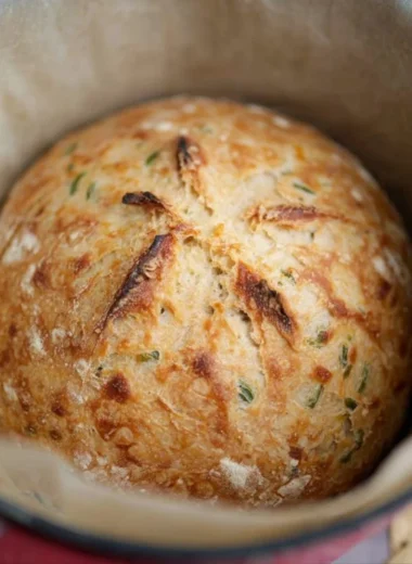 Freshly baked sourdough jalapeño cheddar artisan bread with a golden crust
