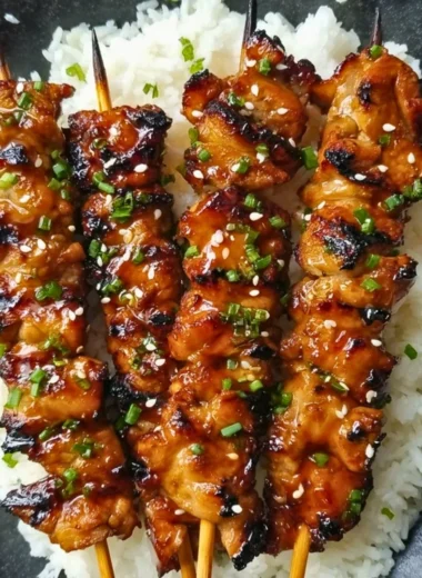 Grilled teriyaki chicken skewers served on a plate
