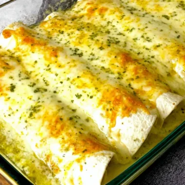 Delicious white chicken enchiladas topped with creamy sauce