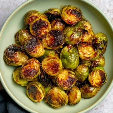 Oven-roasted Maple Balsamic Brussels Sprouts served on a plate