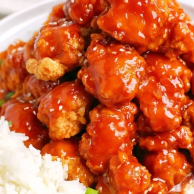 Delicious easy sesame chicken served on a plate with garnish