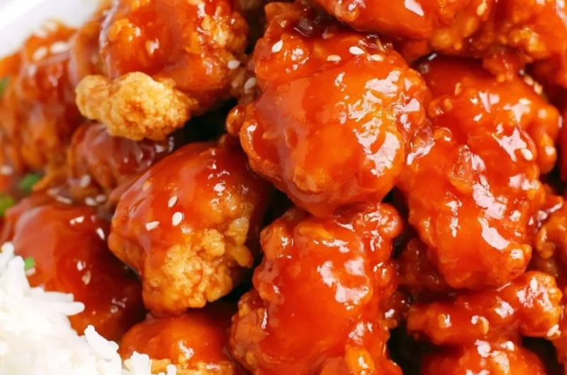 Delicious easy sesame chicken served on a plate with garnish