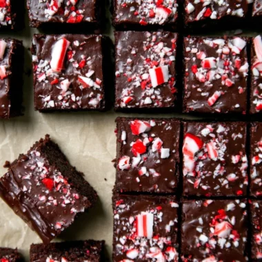 Festive peppermint brownies with decadent ganache in a winter-themed setting.
