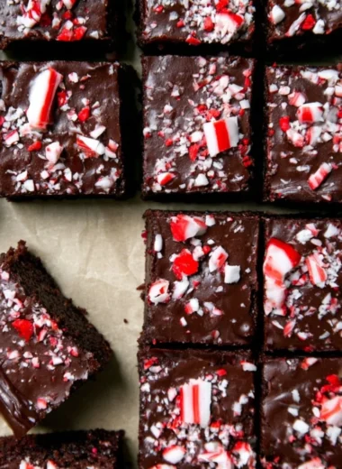Festive peppermint brownies with decadent ganache in a winter-themed setting.