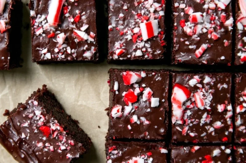 Festive peppermint brownies with decadent ganache in a winter-themed setting.