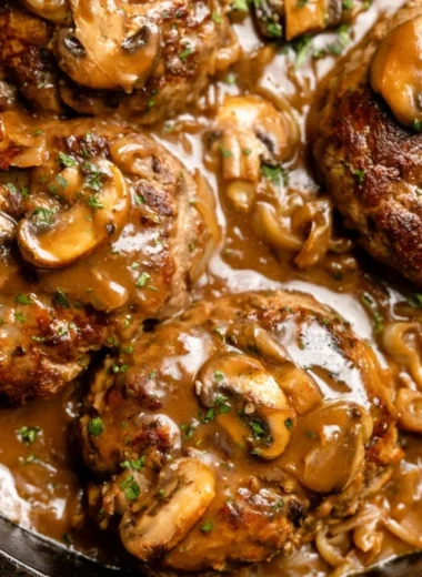 Delicious homemade Salisbury steak served with gravy and mashed potatoes