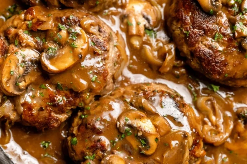 Delicious homemade Salisbury steak served with gravy and mashed potatoes